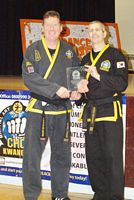 mark lloyd receiving choi kwang do award from Derek Bicknell